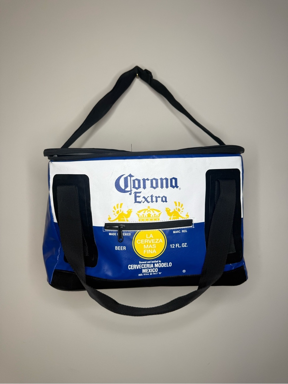 Corona Extra logo insulated cube cooler bag with a blue and white design.